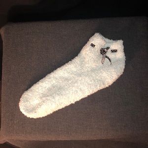 One lonely baby blue fuzzy ankle sock w/ bow
